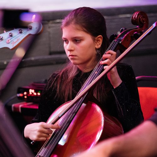 teenage girl playing cello