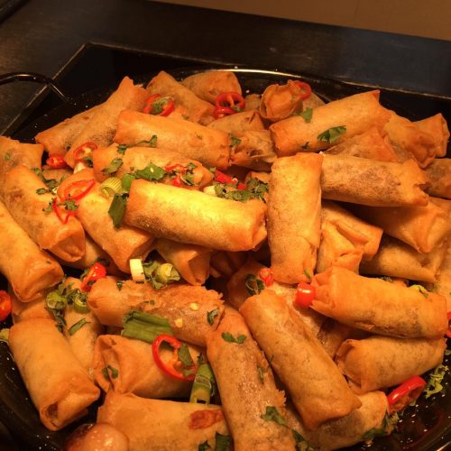 Wok of spring rolls