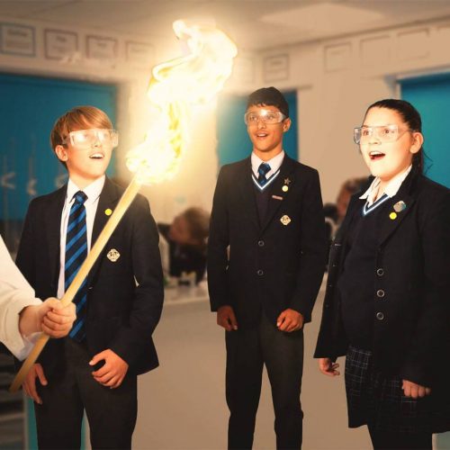 Students looking at a flame