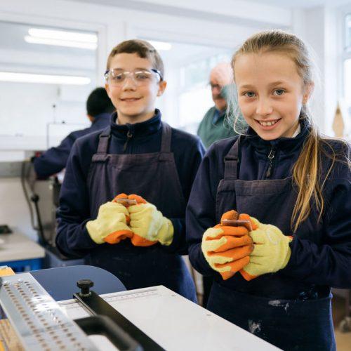 students wearing protective gloves