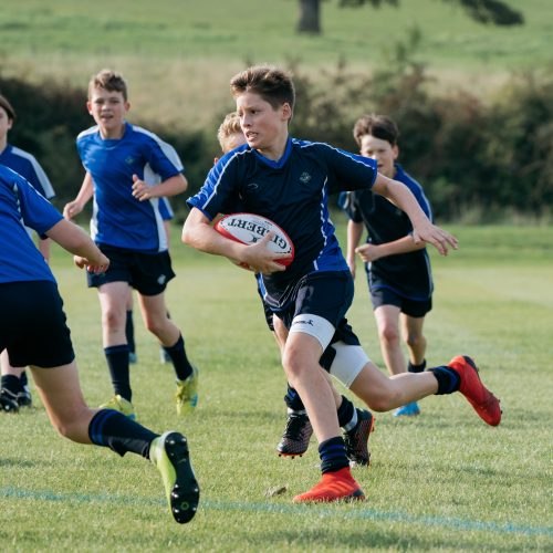 school boys playing rugby