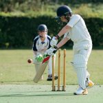 school boys playing cricket