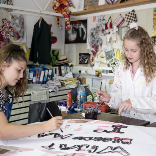 students painting together