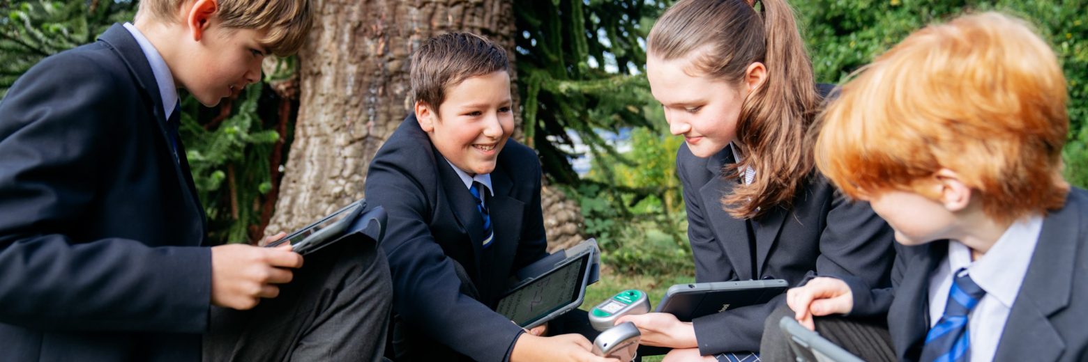 students learning outdoors