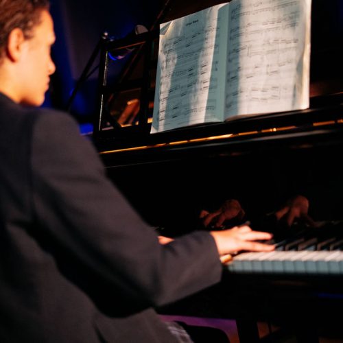 girl playing the piano