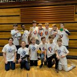 students holding trophy