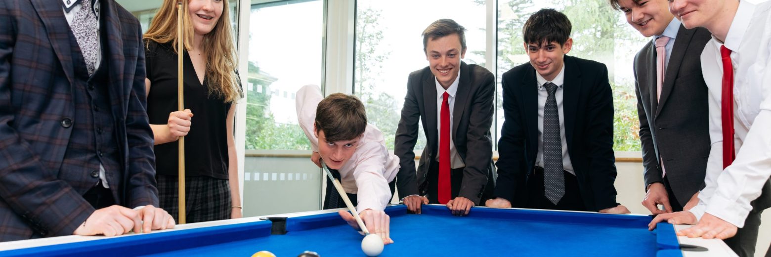 Students playing snooker