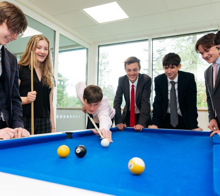 Students playing pool