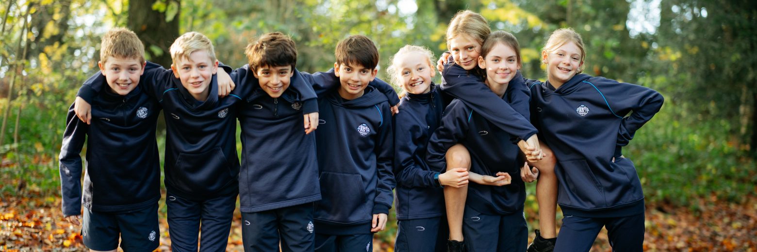 students smiling in the woods