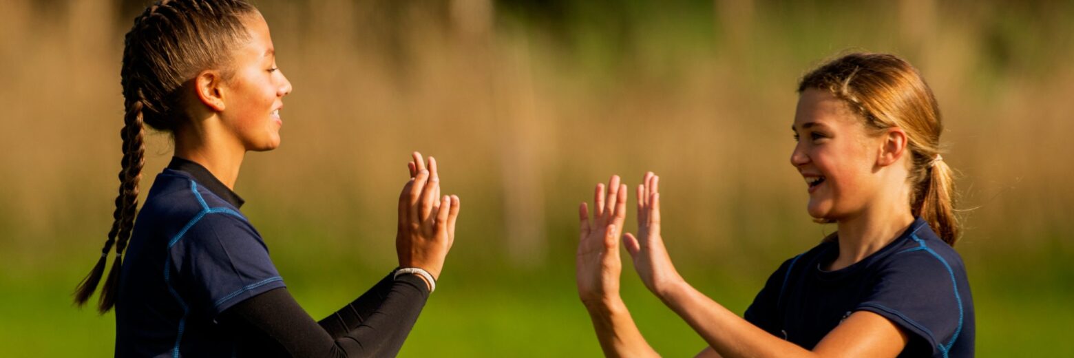 students clapping hands