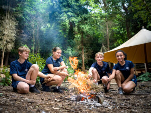 students around a fire