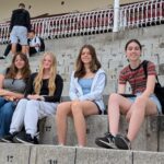 girls sat on steps